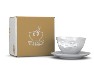 Kaffeetasse grinsend, neben Karton