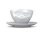 Tasse grinsend